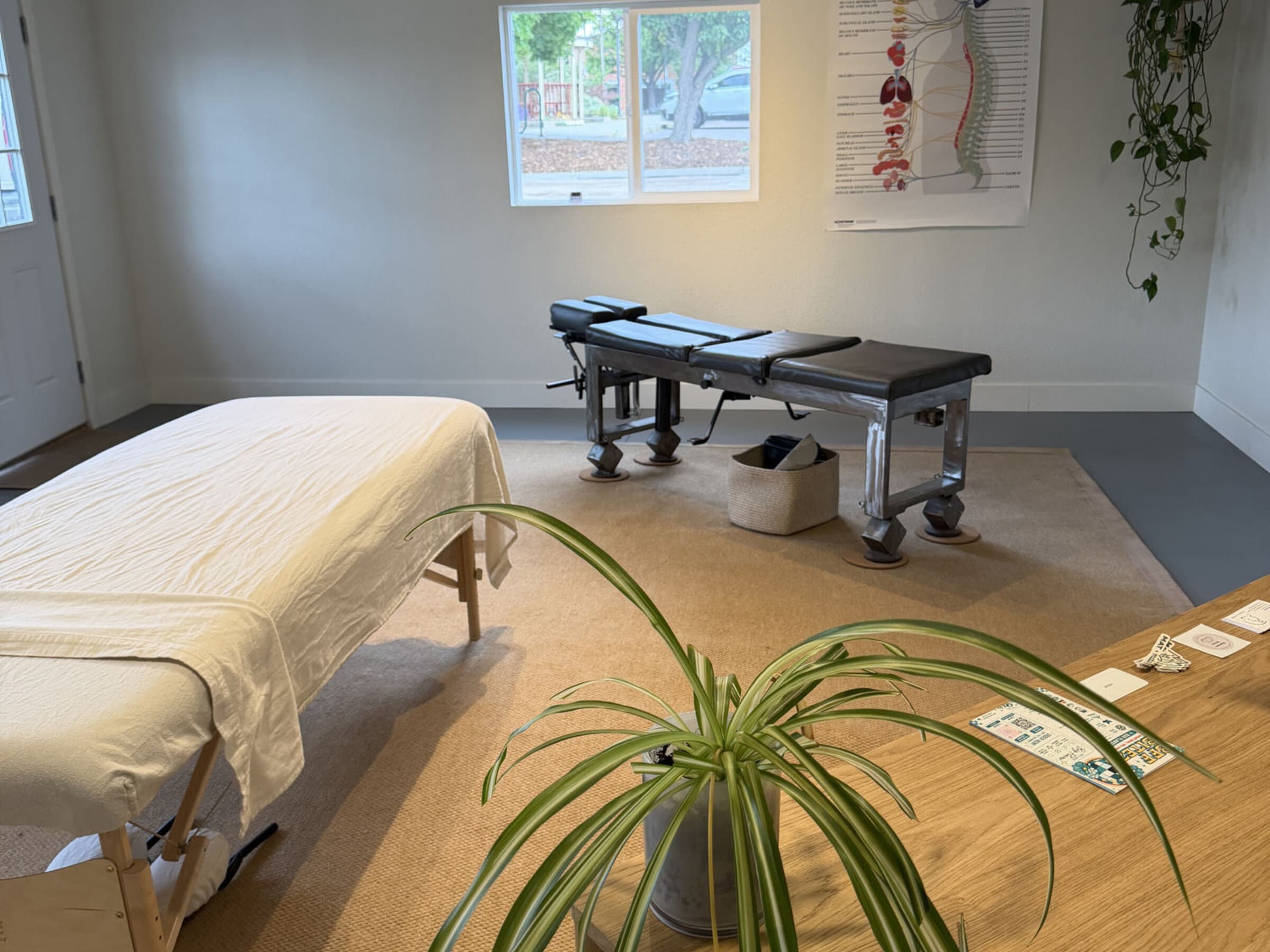 Wellness Room — chiropractic and Rolfing massage tables in a calm space